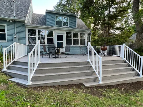 Freshly installed deck with sleek design and outdoor seating area.