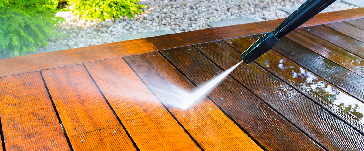 Address Trex deck problems effectively with expert care advice. Image: a deck being revitalized with professional pressure washing.