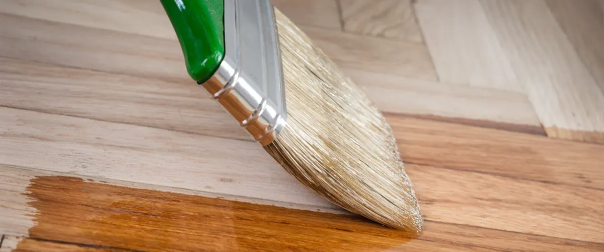 Protect your wooden surfaces with Thompson’s Water Seal. This image shows a close-up of a brush evenly applying water sealant for long-lasting protection.