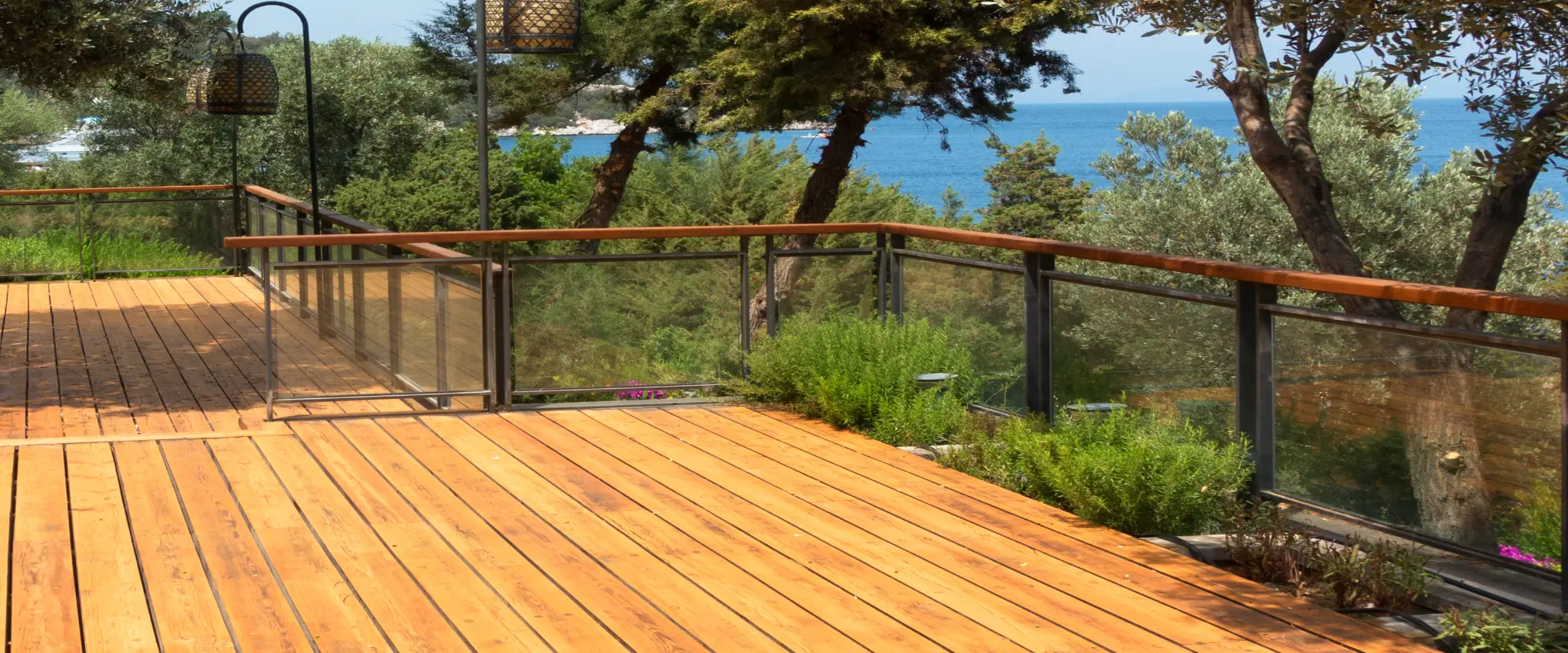 Ocean view deck with stylish glass railings offering panoramic scenic views