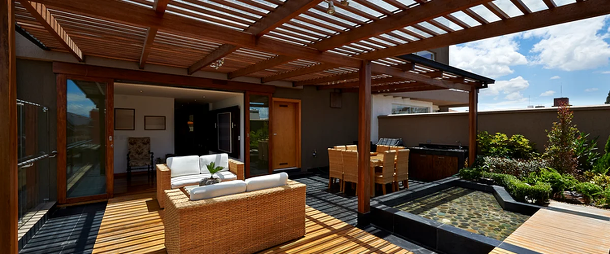 covered deck installation lincoln ne deck building professional covered deck with wooden pergola modern seating and water feature