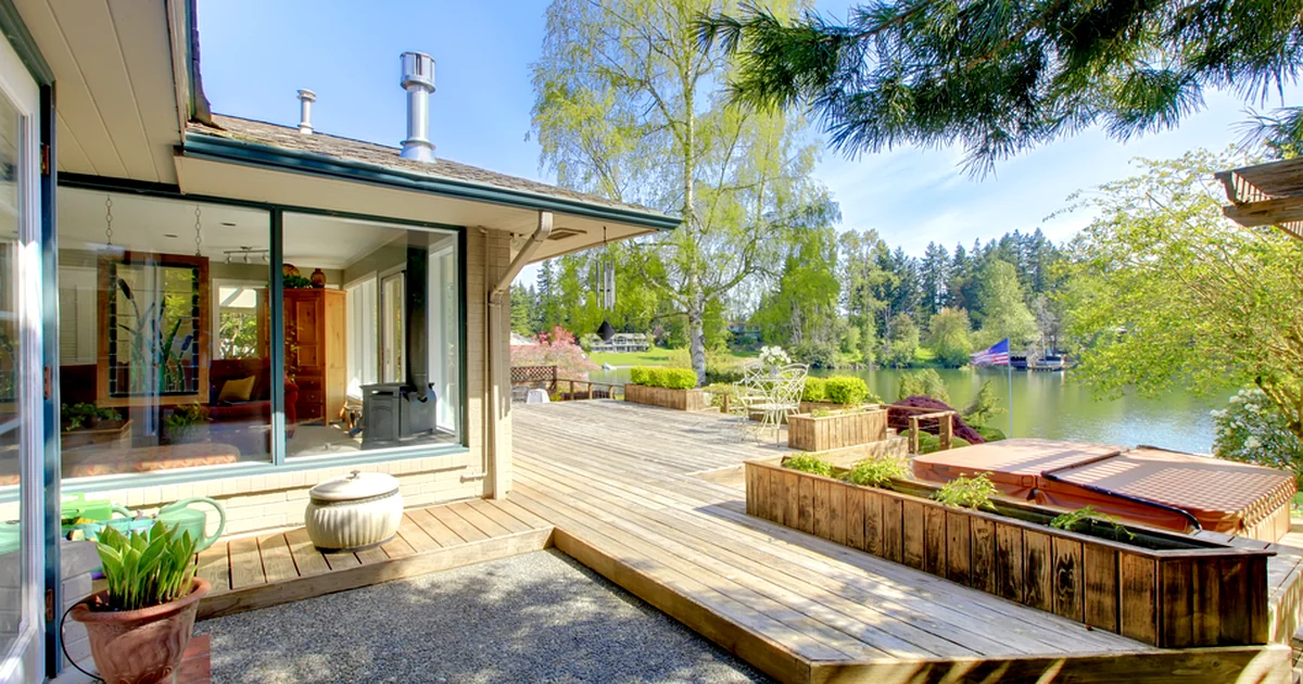 Blog deck safety lincoln ne a professional contractor built wooden deck overlooks a serene lakeside surrounded by lush greenery