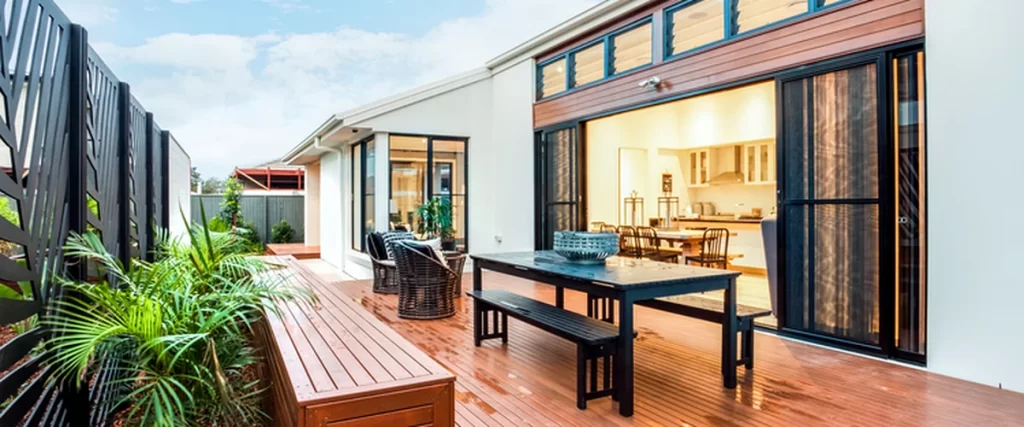 Deck Safety in Lincoln Checklist: How to Know if Your Deck is Secure deck safety lincoln ne modern outdoor patio with wooden decking sliding glass doors and seating