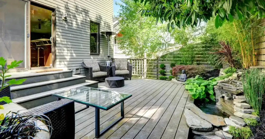 a backyard deck with an outdoor living space