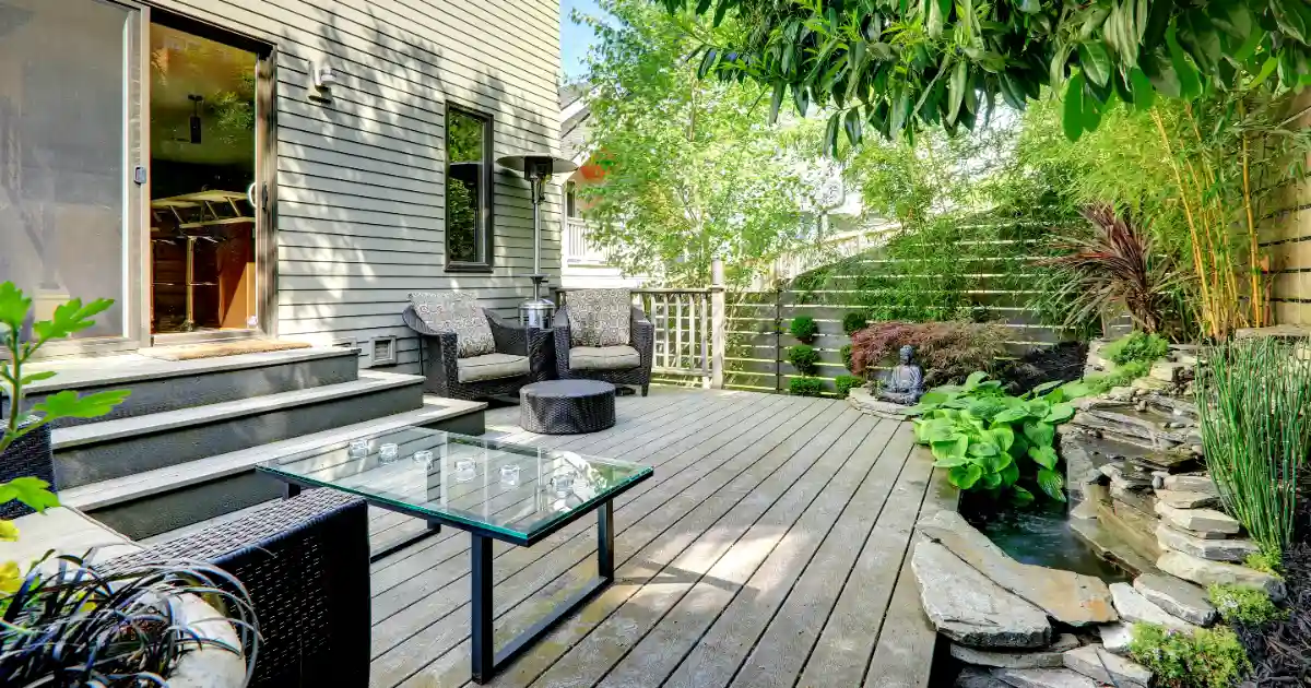 a backyard deck with an outdoor living space