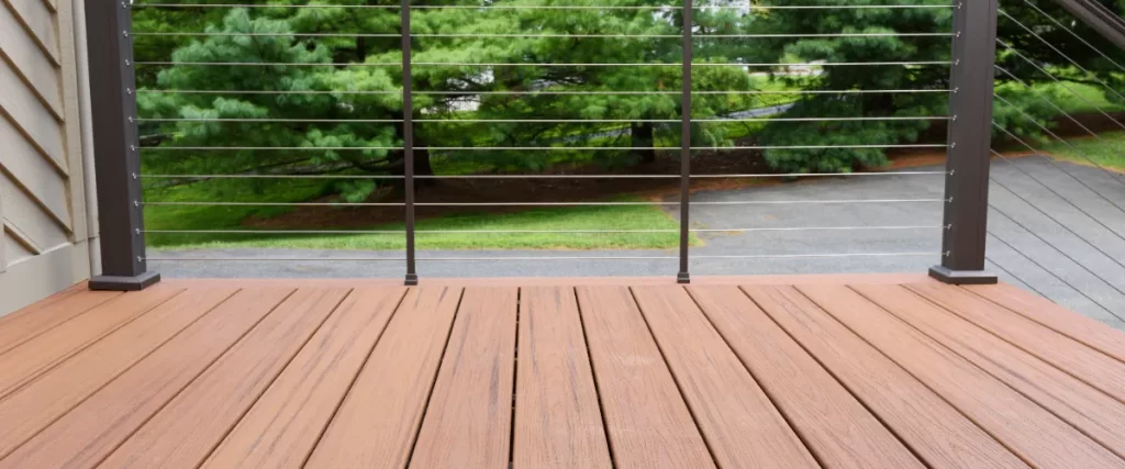 an outdoor deck constructed with Trex composite decking and featuring a modern cable railing system