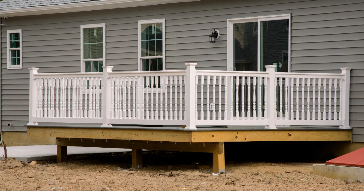a newly constructed outdoor deck attached to a house