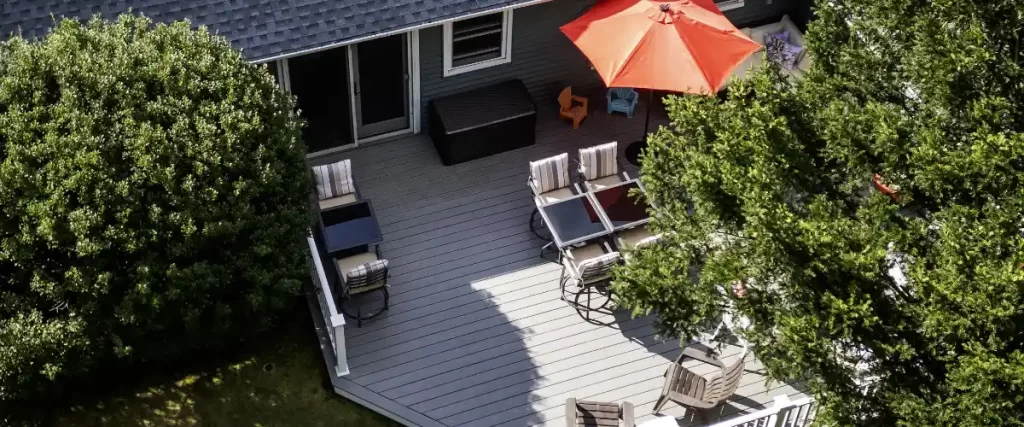 an aerial view of a house with an outdoor deck made of composite decking