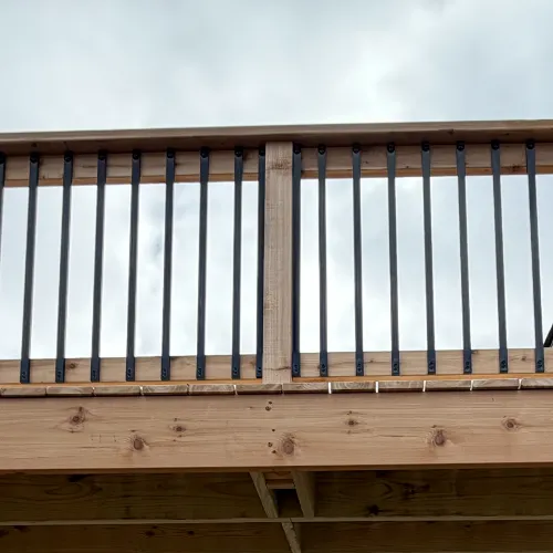 Elevated Cedar Deck Rebuild black metal spindles