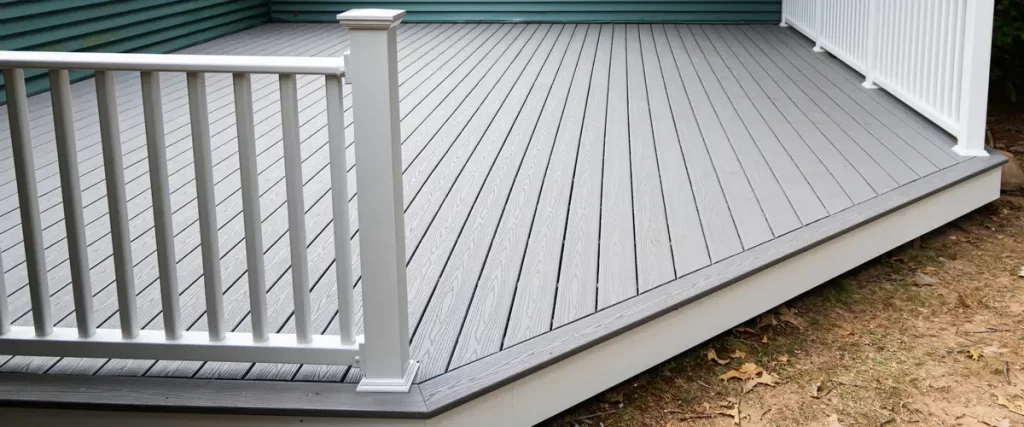 The under-structure of an elevated wooden deck showing joists, beams, and sturdy support posts during construction.