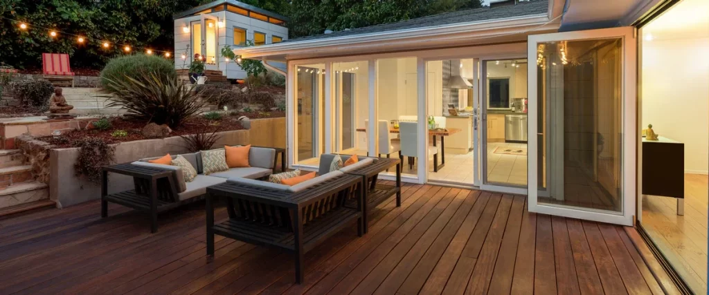 An expansive outdoor living area featuring a covered deck and integrated lighting.